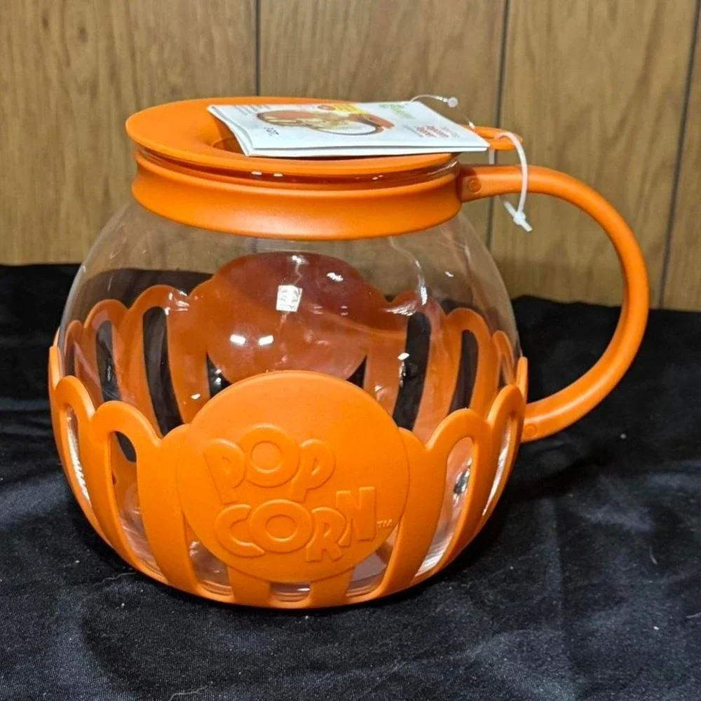 Orange popcorn popper with lid and 3 Qt. capacity